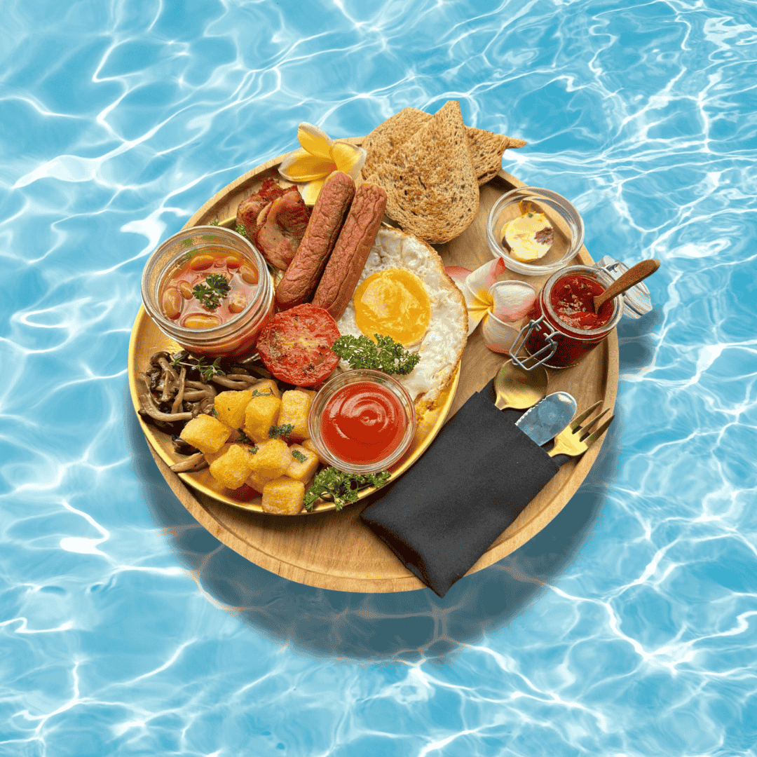 Vegetarian English breakfast tray floating in Bali villa pool