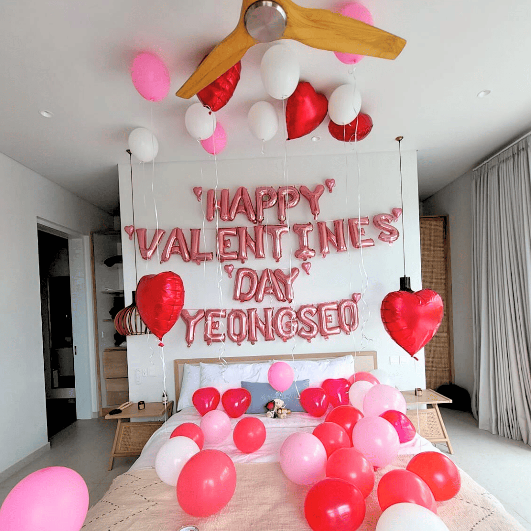 happy valentines decorations and banner setup inside Bali villa bedroom