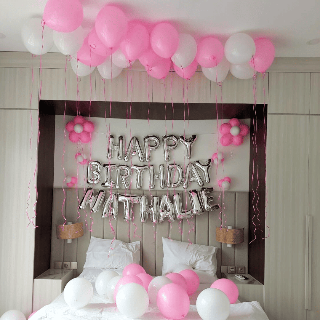 birthday balloon decorations and banner setup inside Bali villa bedroom