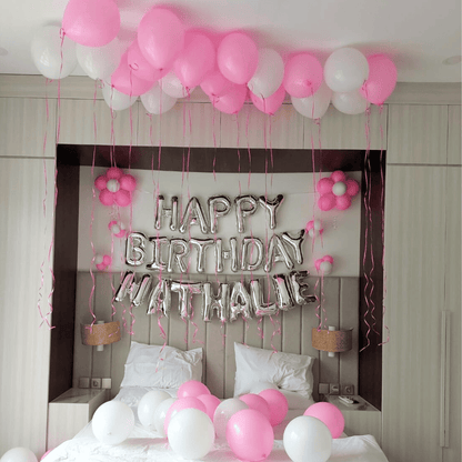 birthday balloon decorations and banner setup inside Bali villa bedroom