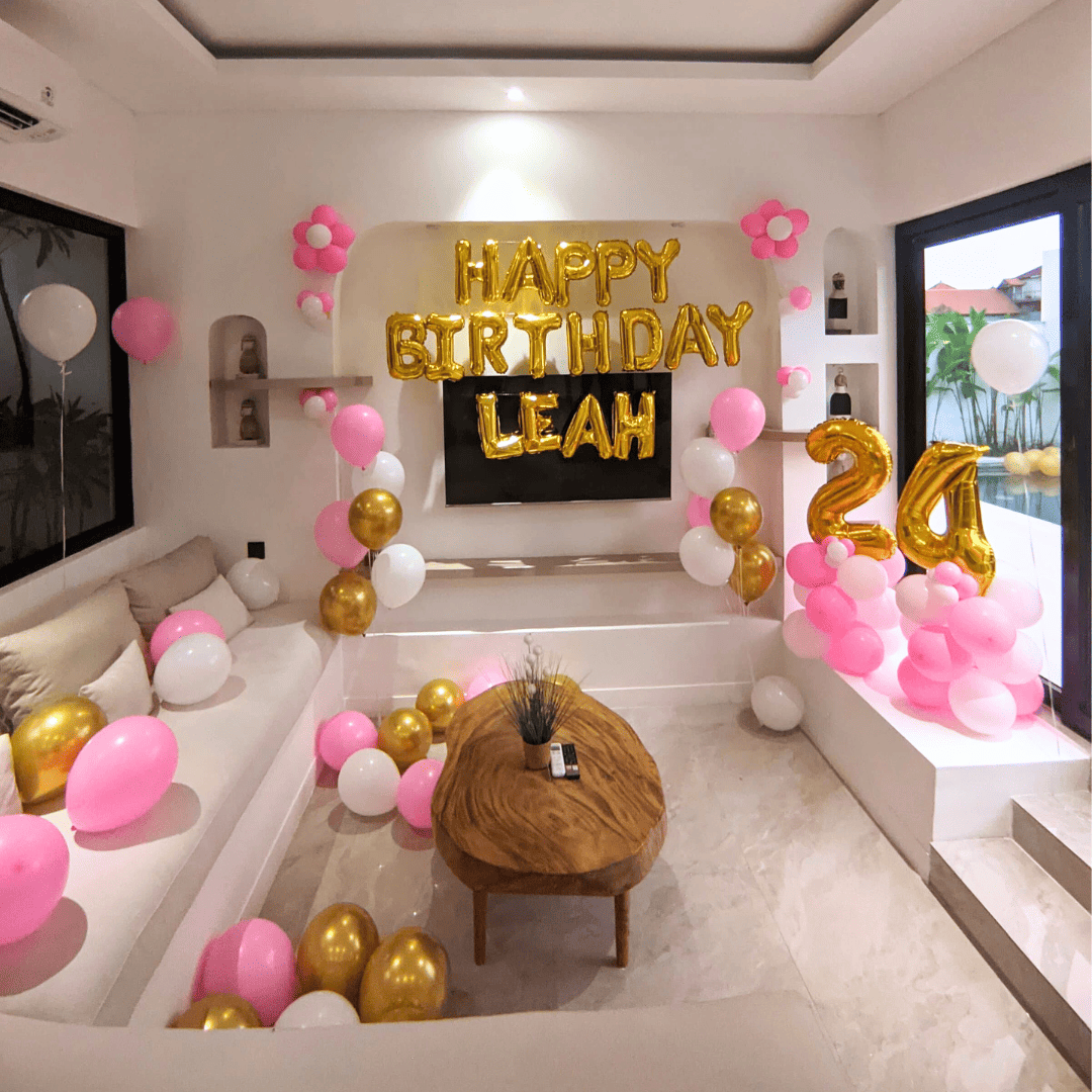 birthday balloon decorations and banner setup inside Bali villa bedroom
