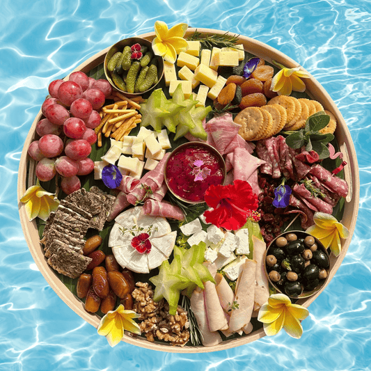 Luxury cheese board with tropical fruits and artisanal cheeses on rattan tray – perfect for Bali villas and special occasions
