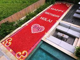 tropical flower petals floating in villa pool Bali